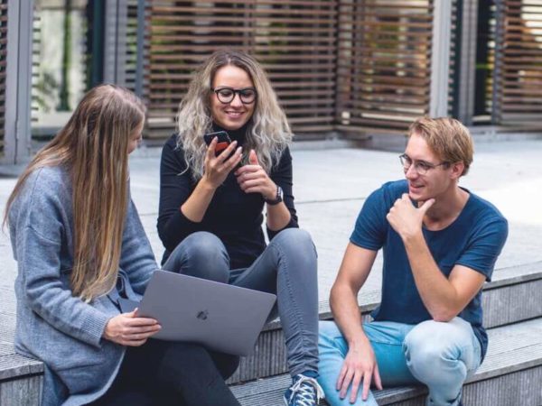 renters around a computer paying rent online