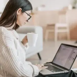 Property Owner drinking coffee looking at property management paperwork