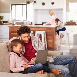 family sitting in kitchen renewing their Henderson Nevada rental lease