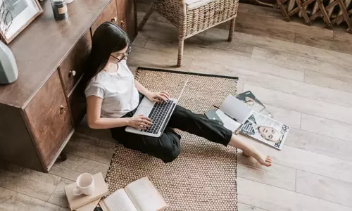 woman applying for a rental home using a laptop