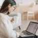 woman drinking coffee looking at property management paperwork